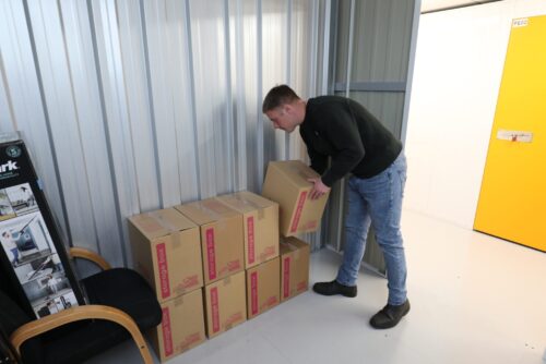 Image of items being moved into a self storage unit