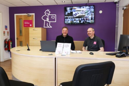 Image of self storage staff sat at reception desk