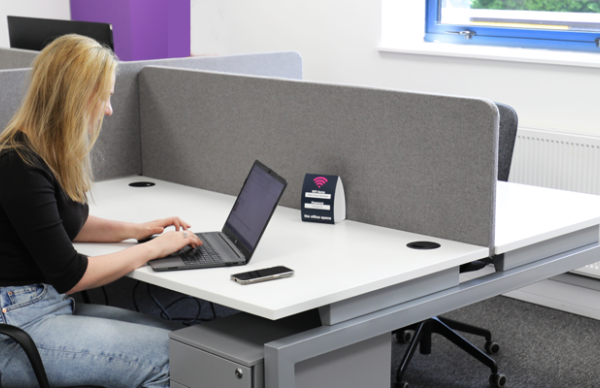 Image of woman working at a desk in an office